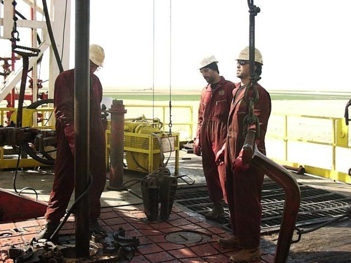 Field personnel and equipment supporting drilling operations